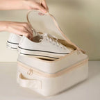 Travel Shoe Storage Bag organizing white sneakers in a 3-layer waterproof storage bag for travel.