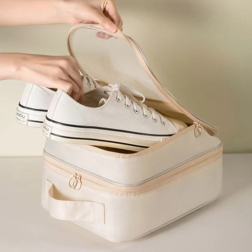 Travel Shoe Storage Bag organizing white sneakers in a 3-layer waterproof storage bag for travel.